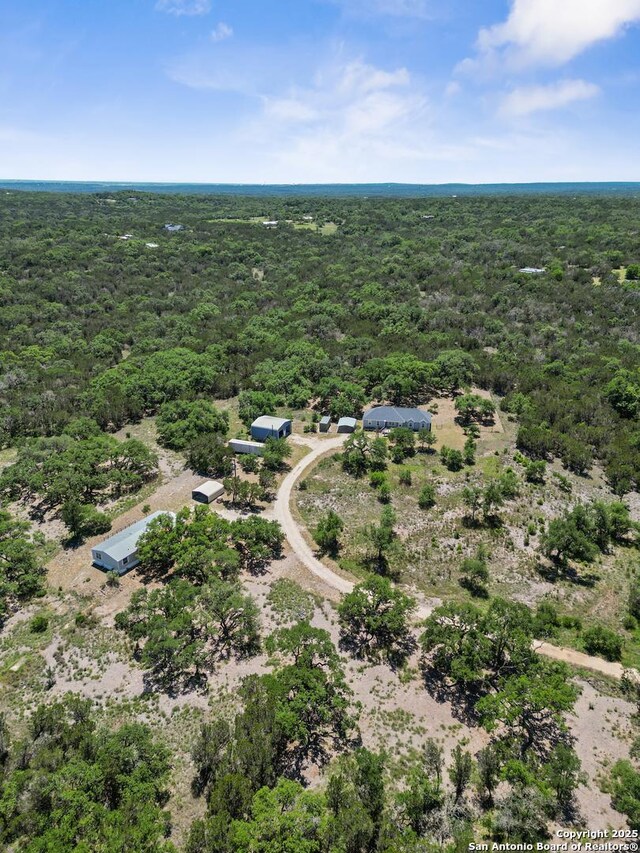 aerial view featuring a view of trees