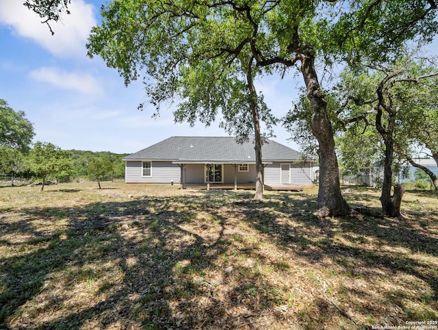 back of house featuring fence
