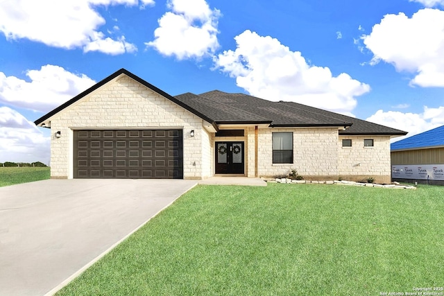 view of front of property featuring driveway, french doors, a front lawn, and a garage