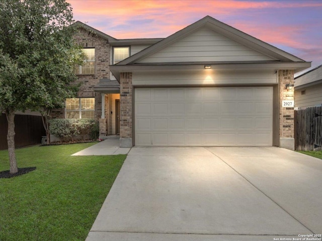 2927 Lindenwood, San Antonio, TX 78245 - view of front of home featuring a lawn, fence, brick siding, an attached garage, and driveway