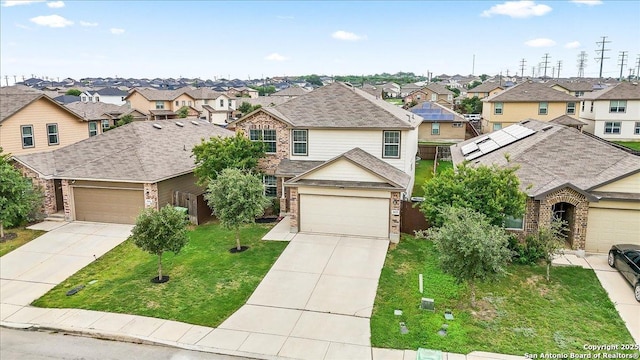 2927 Lindenwood, San Antonio, TX 78245 - traditional-style home featuring brick siding, a front yard, driveway, and a residential view
