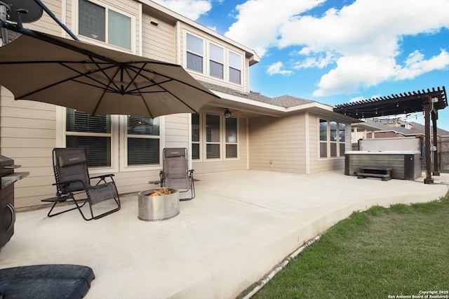 14447 Costa Leon, San Antonio, TX 78245 - rear view of property featuring a patio area, a hot tub, a fire pit, and a pergola