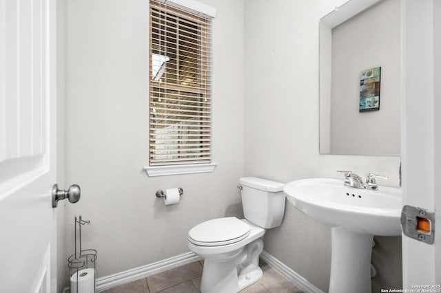 14447 Costa Leon, San Antonio, TX 78245 - half bath with toilet, tile patterned floors, and baseboards