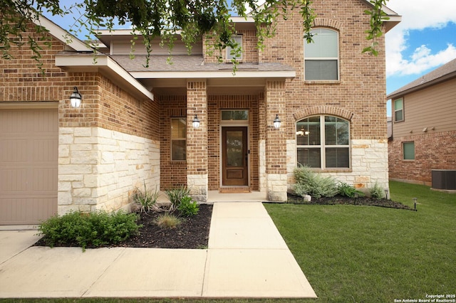 14447 Costa Leon, San Antonio, TX 78245 - entrance to property featuring brick siding, cooling unit, a yard, and a garage