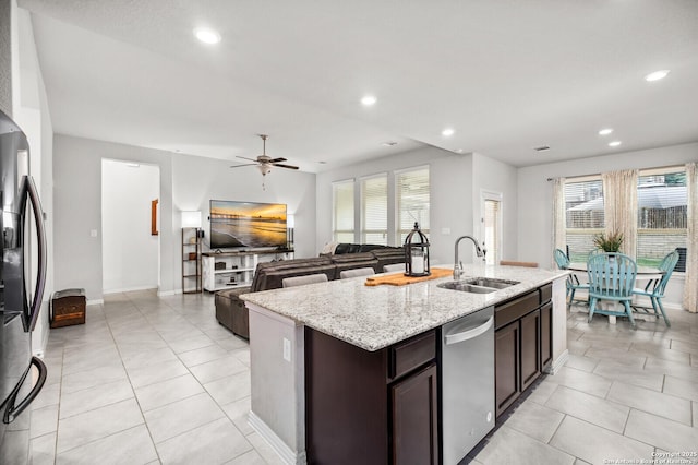 14447 Costa Leon, San Antonio, TX 78245 - kitchen featuring a sink, stainless steel appliances, a kitchen island with sink, dark brown cabinets, and recessed lighting