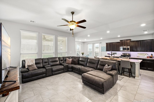 14447 Costa Leon, San Antonio, TX 78245 - living room featuring ceiling fan, recessed lighting, and light tile patterned floors