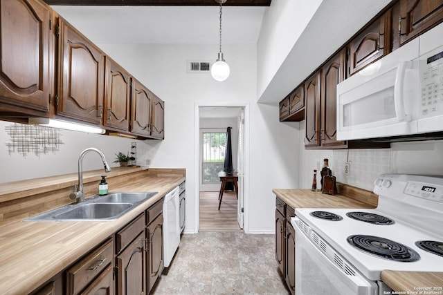 14320 Forum Rd, Universal City, TX 78148 - kitchen with visible vents, pendant lighting, tasteful backsplash, a sink, and white appliances