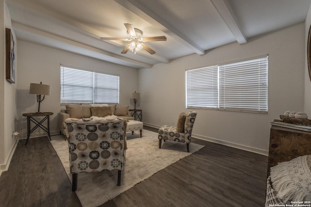 living room featuring baseboards, ceiling fan, beam ceiling, and wood finished floors