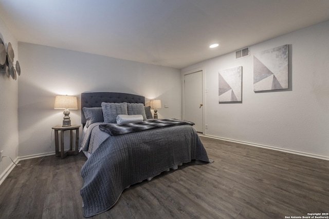 bedroom featuring baseboards, recessed lighting, wood finished floors, and visible vents