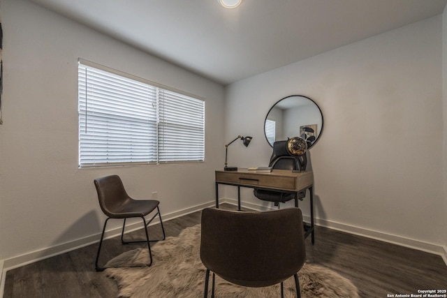 home office featuring baseboards and dark wood finished floors