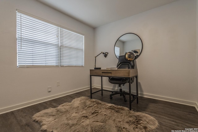 office space with baseboards and wood finished floors