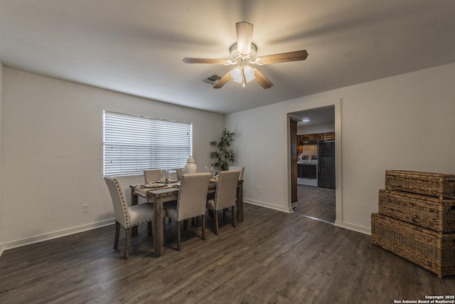 dining room featuring visible vents, dark wood-style flooring, ceiling fan, and baseboards