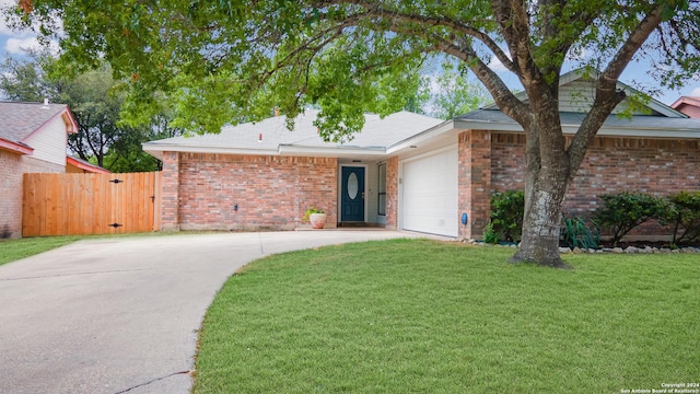 single story home with a front yard, a gate, a garage, brick siding, and concrete driveway