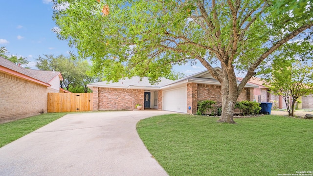 ranch-style house with a front yard, a gate, brick siding, concrete driveway, and an attached garage