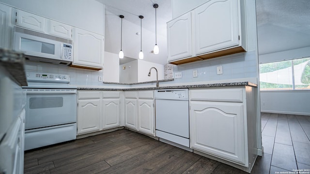 kitchen featuring white appliances, white cabinets, and decorative backsplash