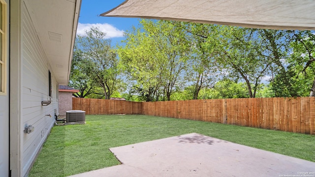 view of yard featuring a patio, a fenced backyard, and cooling unit