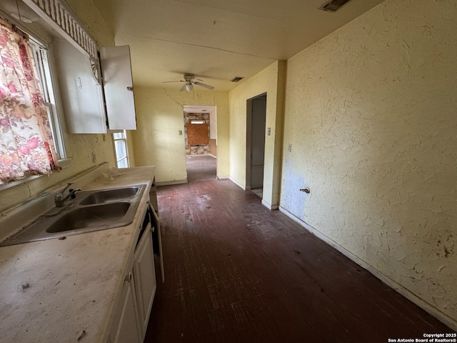274 Gayle, San Antonio, TX 78223 - kitchen with a sink, dark wood finished floors, a ceiling fan, and a healthy amount of sunlight