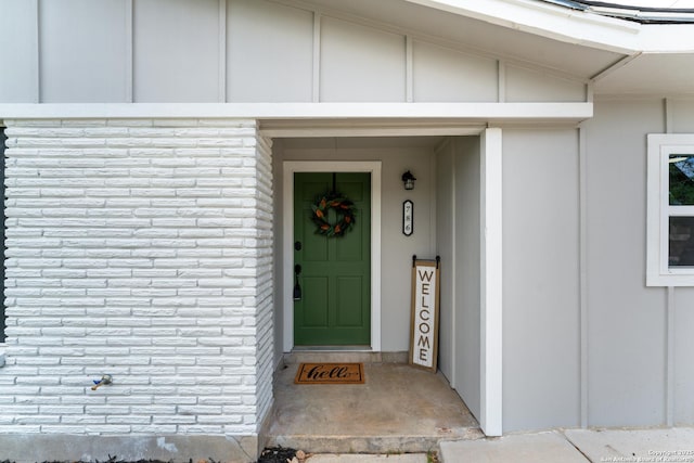 doorway to property with board and batten siding