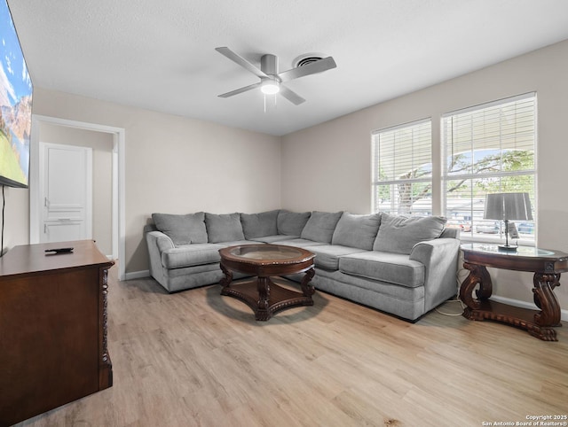 3354 Bob Billa, San Antonio, TX 78223 - living room featuring visible vents, baseboards, ceiling fan, and wood finished floors