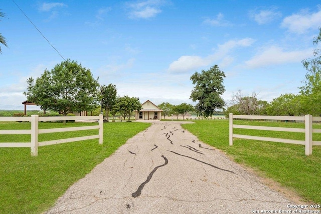 14830 Fm 1346, Saint Hedwig, TX 78152 - view of front of house with fence, a rural view, driveway, and a front yard