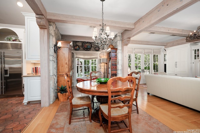 220 N School St, Boerne, TX 78006 - dining area featuring an inviting chandelier, a healthy amount of sunlight, and light wood-type flooring