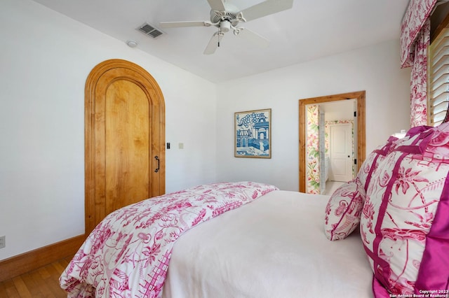 220 N School St, Boerne, TX 78006 - bedroom with baseboards, a ceiling fan, wood finished floors, and visible vents