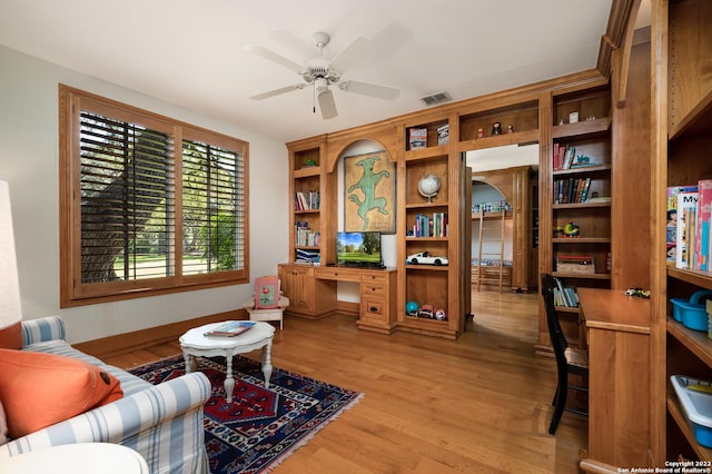 220 N School St, Boerne, TX 78006 - living area with visible vents, light wood-style floors, ceiling fan, and built in study area