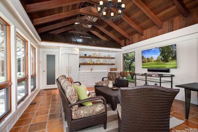 220 N School St, Boerne, TX 78006 - sunroom featuring lofted ceiling with beams, tile patterned flooring, a chandelier, wooden ceiling, and visible vents
