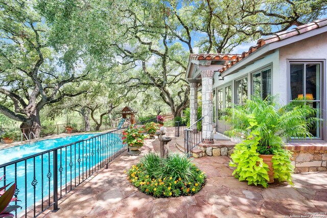 220 N School St, Boerne, TX 78006 - view of patio with a fenced in pool and fence