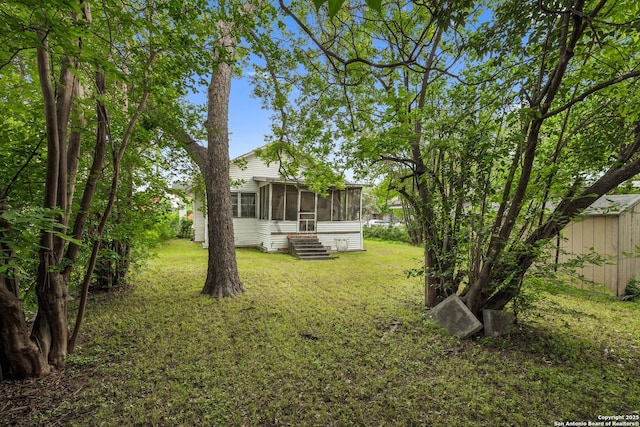 view of yard with a sunroom
