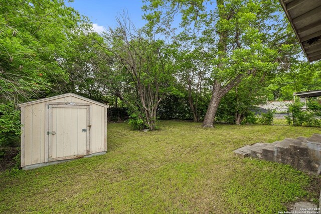3403 W Travis, San Antonio, TX 78207 - view of yard featuring fence, an outbuilding, and a shed
