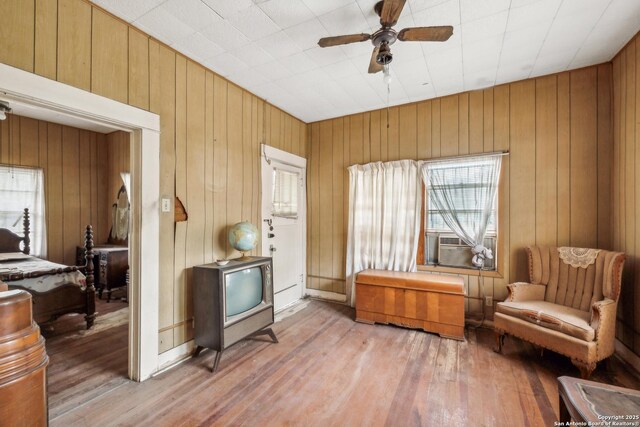 3403 W Travis, San Antonio, TX 78207 - living area with ceiling fan, wood finished floors, and a healthy amount of sunlight