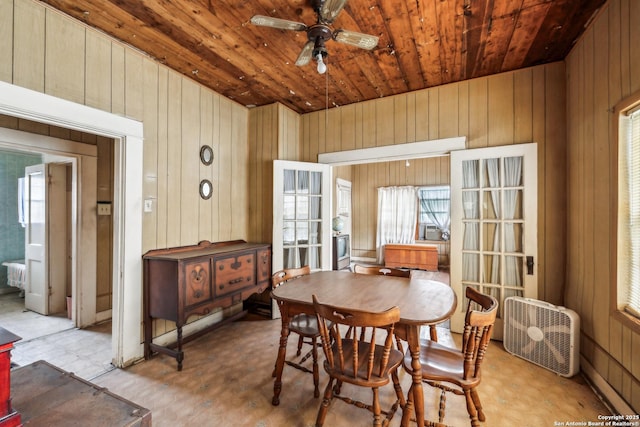 3403 W Travis, San Antonio, TX 78207 - dining room with wood ceiling, ceiling fan, wooden walls, and a healthy amount of sunlight