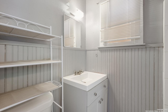 bathroom with wainscoting and vanity