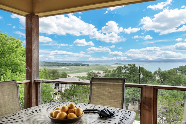 1298 Oakridge Ln, Canyon Lake, TX 78133 - balcony featuring a water view and outdoor dining area