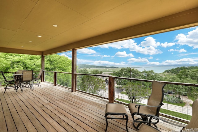 wooden deck with outdoor dining space