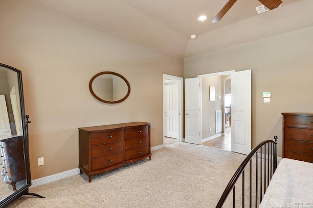 bedroom featuring baseboards, visible vents, and light colored carpet