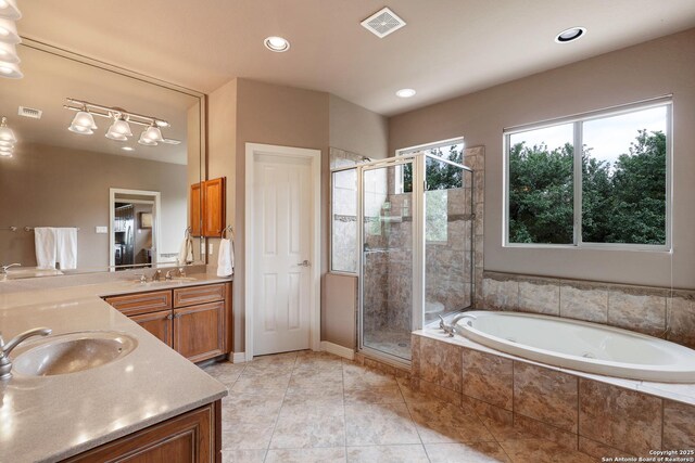 1298 Oakridge Ln, Canyon Lake, TX 78133 - full bath with double vanity, a sink, a bath, and a stall shower