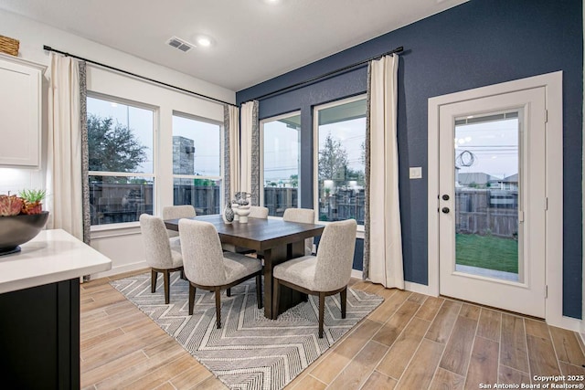 dining area featuring recessed lighting, baseboards, light wood finished floors, and visible vents