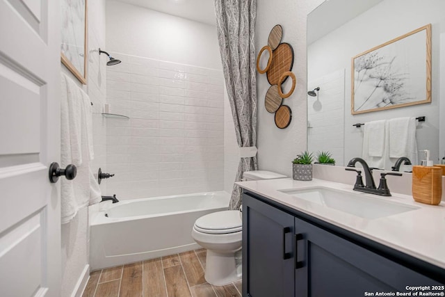bathroom with vanity, shower / bathtub combination with curtain, wood finish floors, and toilet