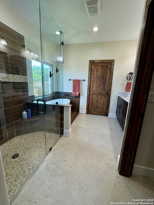 120 Sam Houston, Kerrville, TX 78028 - full bath with a shower stall, a soaking tub, baseboards, and recessed lighting