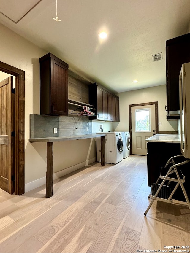 120 Sam Houston, Kerrville, TX 78028 - laundry room featuring cabinet space, washing machine and clothes dryer, light wood-style floors, baseboards, and recessed lighting
