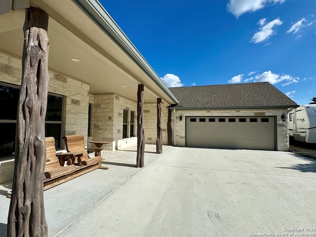 120 Sam Houston, Kerrville, TX 78028 - view of patio / terrace with driveway and a garage