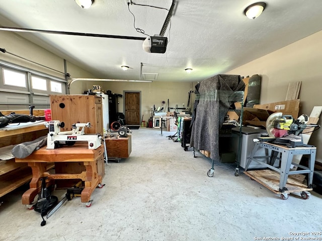 120 Sam Houston, Kerrville, TX 78028 - garage with a garage door opener and a workshop area