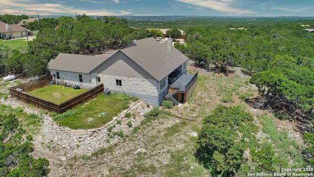 120 Sam Houston, Kerrville, TX 78028 - aerial view of property and surrounding area featuring a heavily wooded area