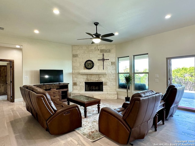 120 Sam Houston, Kerrville, TX 78028 - living area with plenty of natural light, ceiling fan, recessed lighting, a fireplace, and light wood finished floors