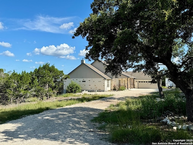 120 Sam Houston, Kerrville, TX 78028 - view of front facade with driveway, a garage, and a chimney