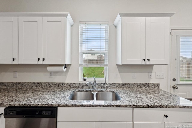 kitchen with a sink, white cabinetry, and dishwasher