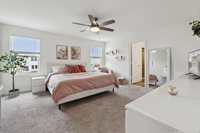 bedroom featuring a ceiling fan and light colored carpet