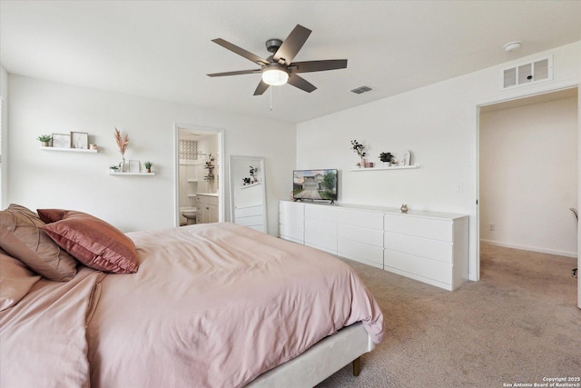 bedroom with visible vents, a ceiling fan, carpet, and ensuite bath